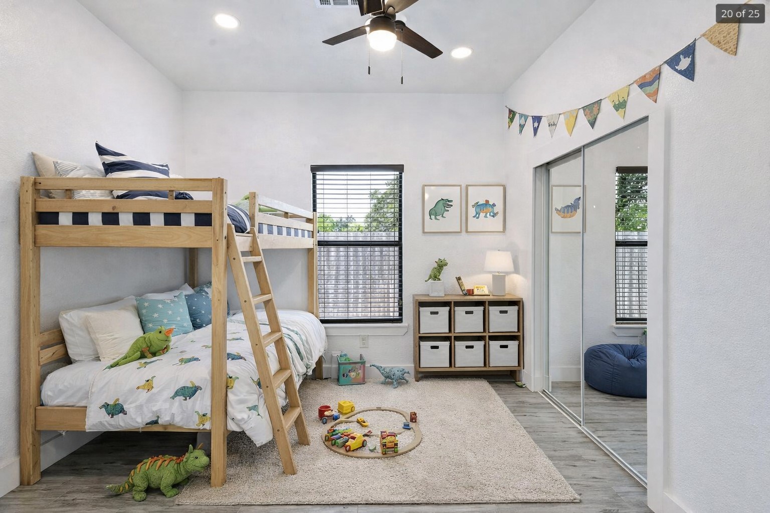 314 Saxon Lane Austin, TX 78741 - Photo 19 of 24 a bedroom with furniture and a wooden floor