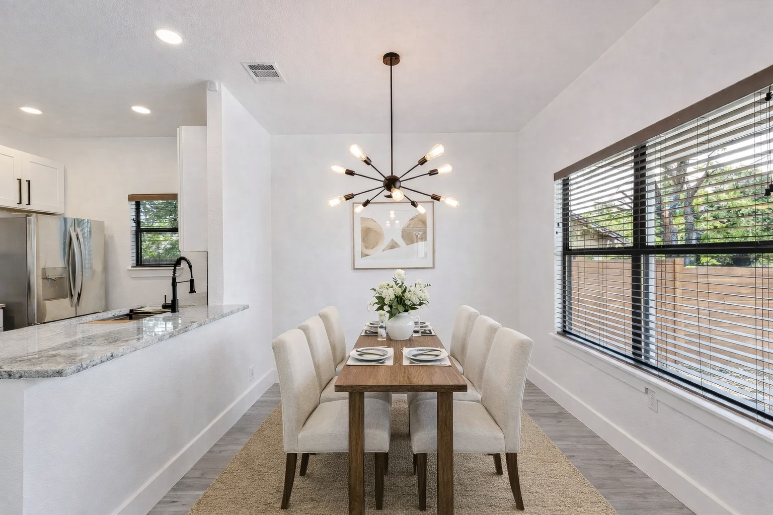314 Saxon Lane Austin, TX 78741 - Photo 7 of 24 a dining room with furniture a chandelier and window