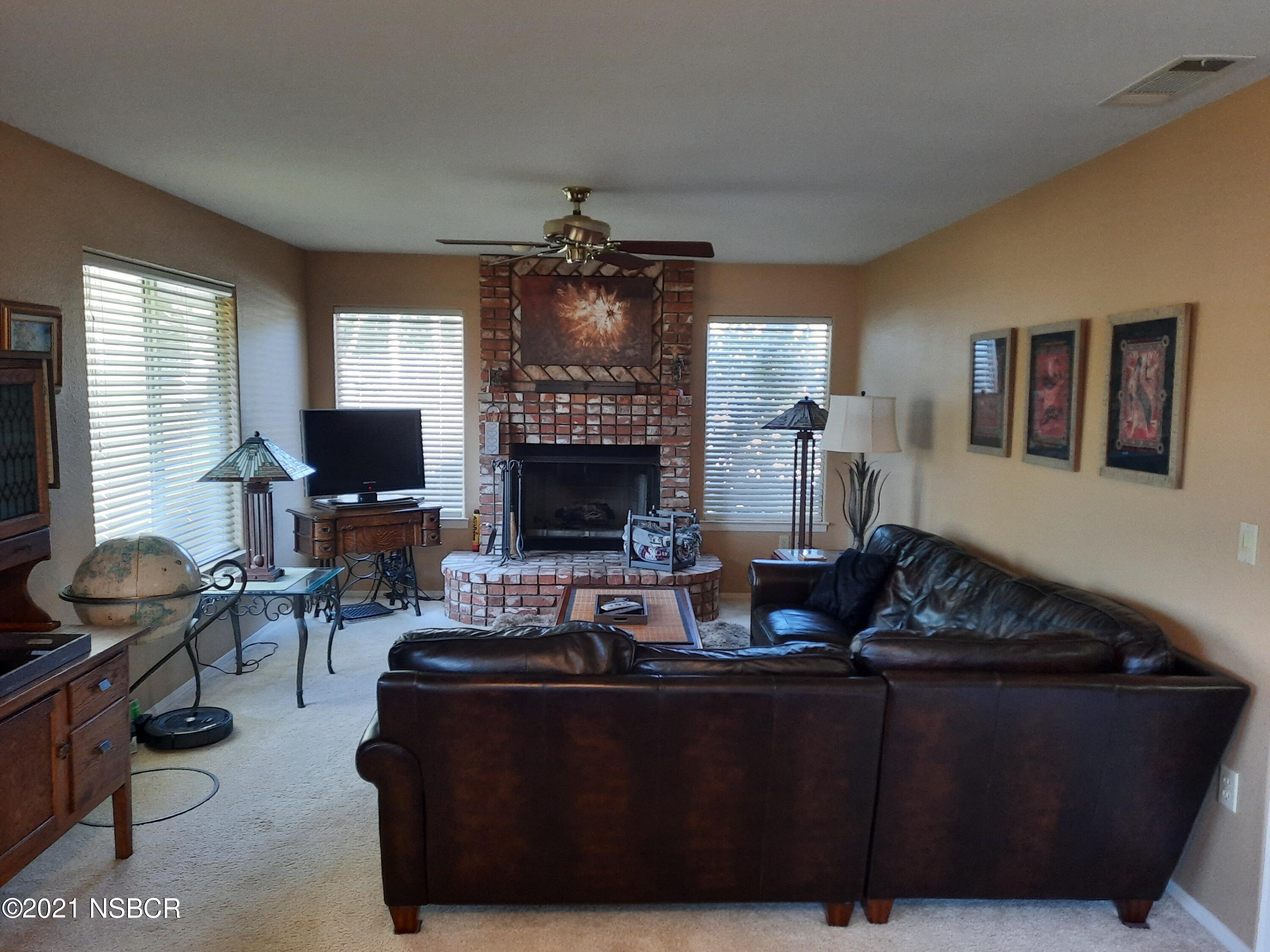 3165 Christopher Drive Lompoc, CA 93436 - Photo 12 of 52 a living room with furniture and a fireplace