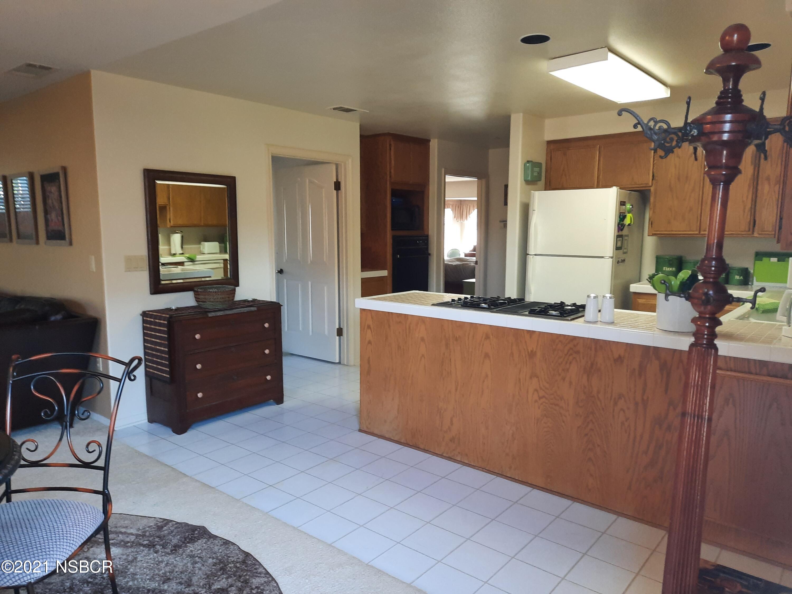 3165 Christopher Drive Lompoc, CA 93436 - Photo 18 of 52 a living room with furniture and a flat screen tv
