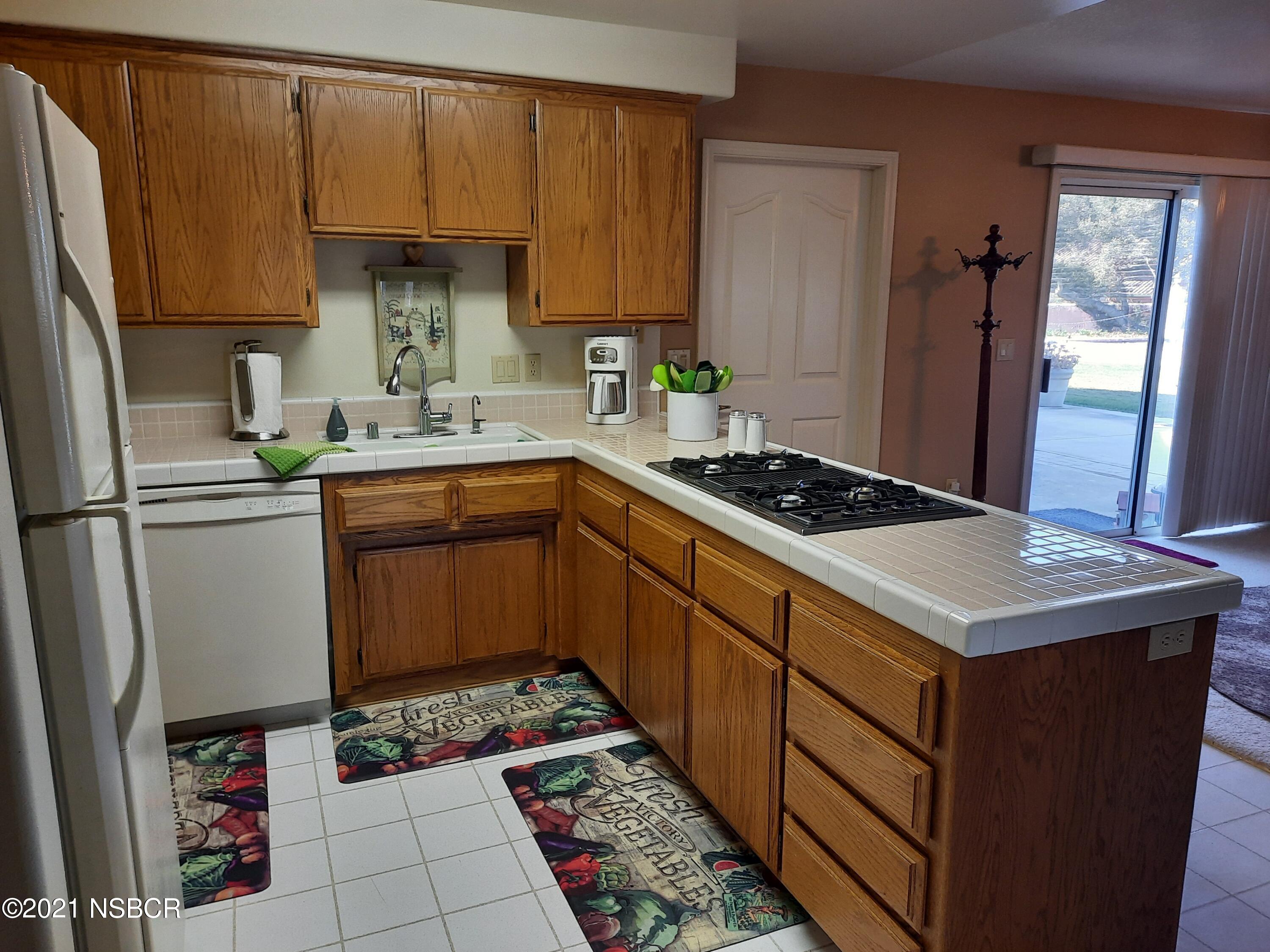 3165 Christopher Drive Lompoc, CA 93436 - Photo 20 of 52 a kitchen with a sink stove and refrigerator