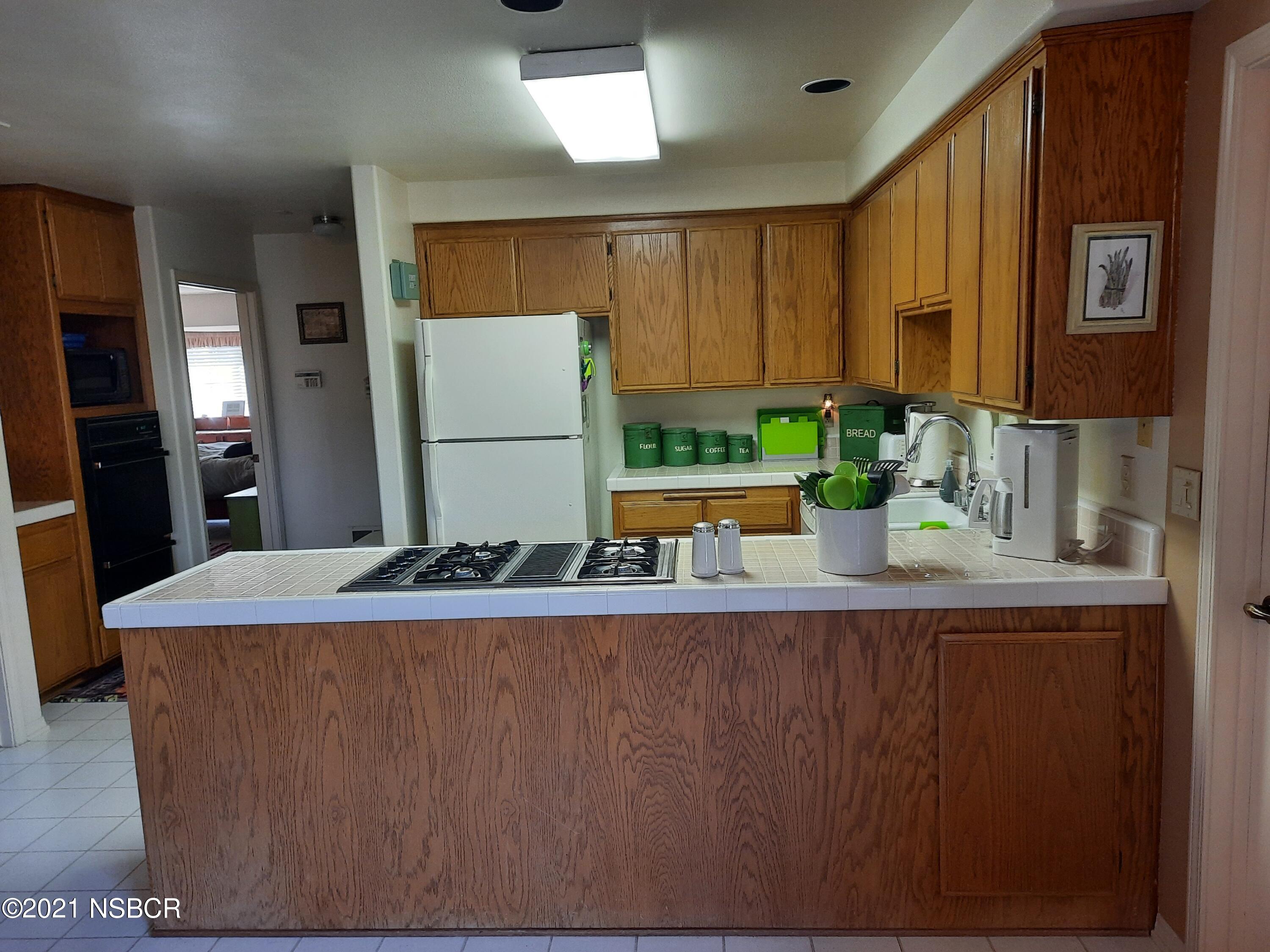3165 Christopher Drive Lompoc, CA 93436 - Photo 21 of 52 a room with a sink and a refrigerator