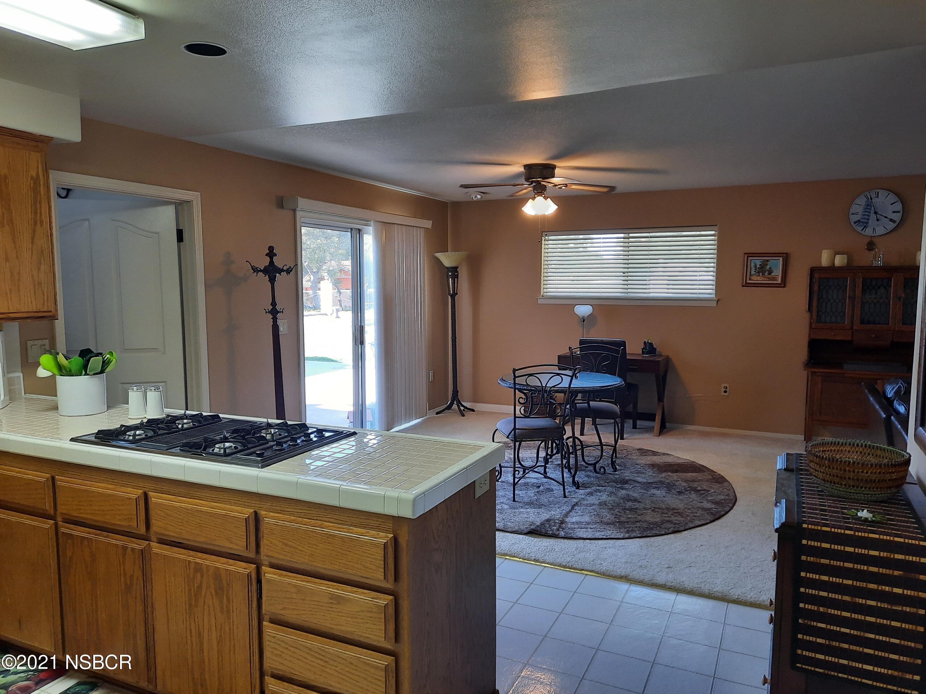 3165 Christopher Drive Lompoc, CA 93436 - Photo 22 of 52 a kitchen with a table and chairs in it