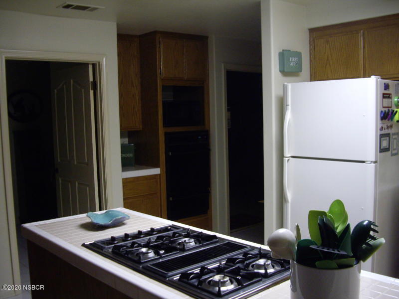 3165 Christopher Drive Lompoc, CA 93436 - Photo 23 of 52 a kitchen with a stove and a refrigerator