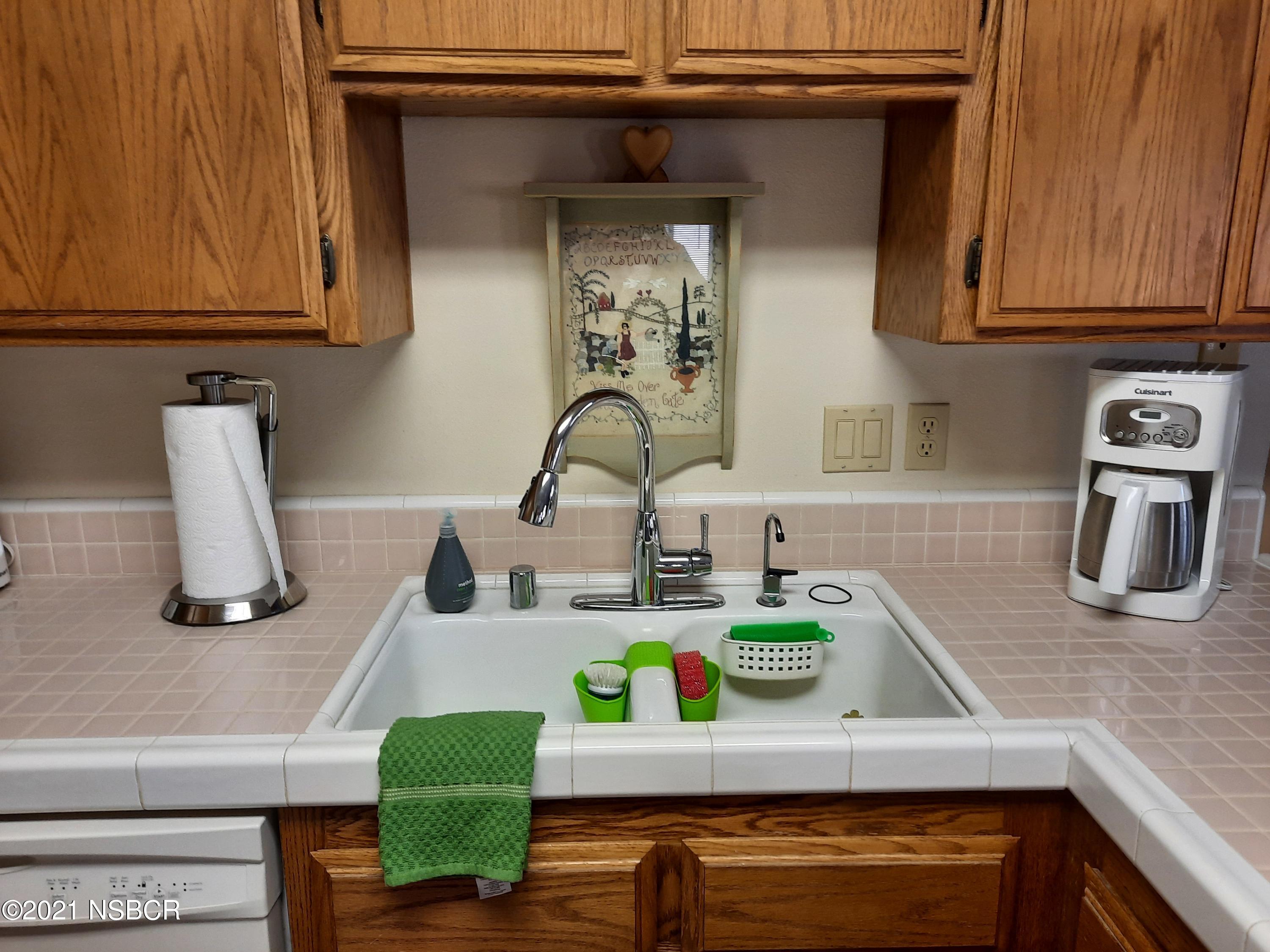 3165 Christopher Drive Lompoc, CA 93436 - Photo 24 of 52 a kitchen with a sink cabinets and appliances
