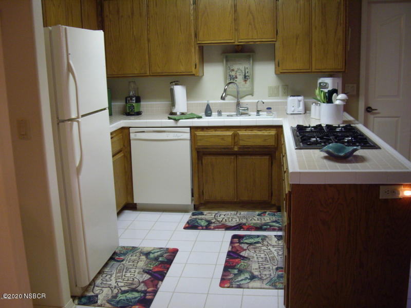 3165 Christopher Drive Lompoc, CA 93436 - Photo 25 of 52 a kitchen with a sink stove and refrigerator