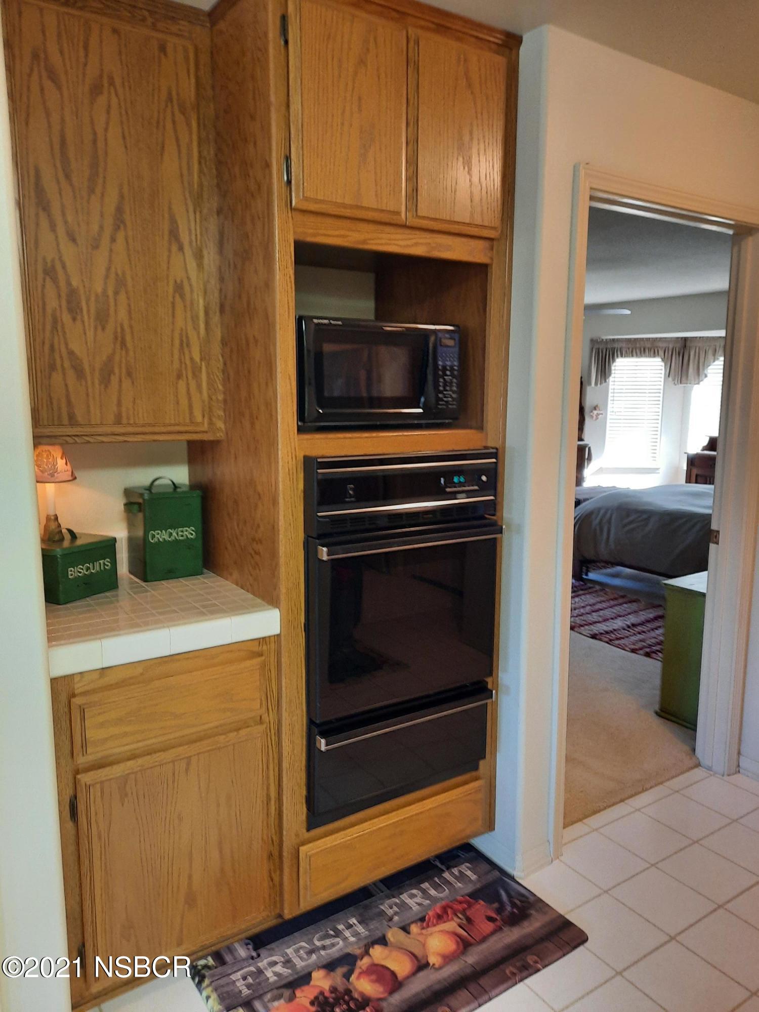 3165 Christopher Drive Lompoc, CA 93436 - Photo 27 of 52 a kitchen with a stove and a microwave