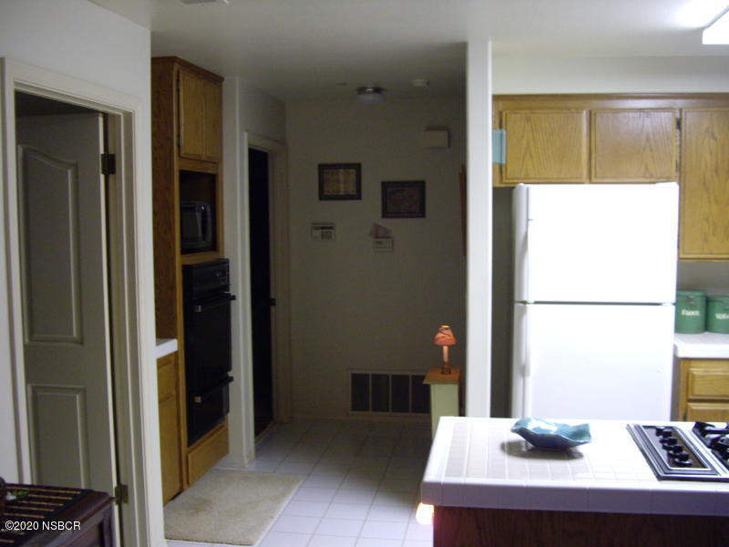 3165 Christopher Drive Lompoc, CA 93436 - Photo 30 of 52 a room with a table and a window