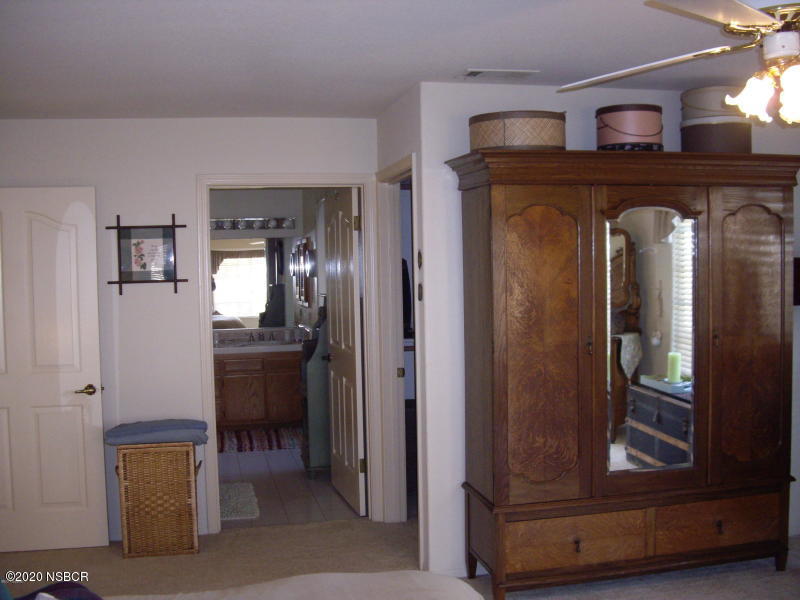 3165 Christopher Drive Lompoc, CA 93436 - Photo 36 of 52 a view of hallway with furniture and a mirror