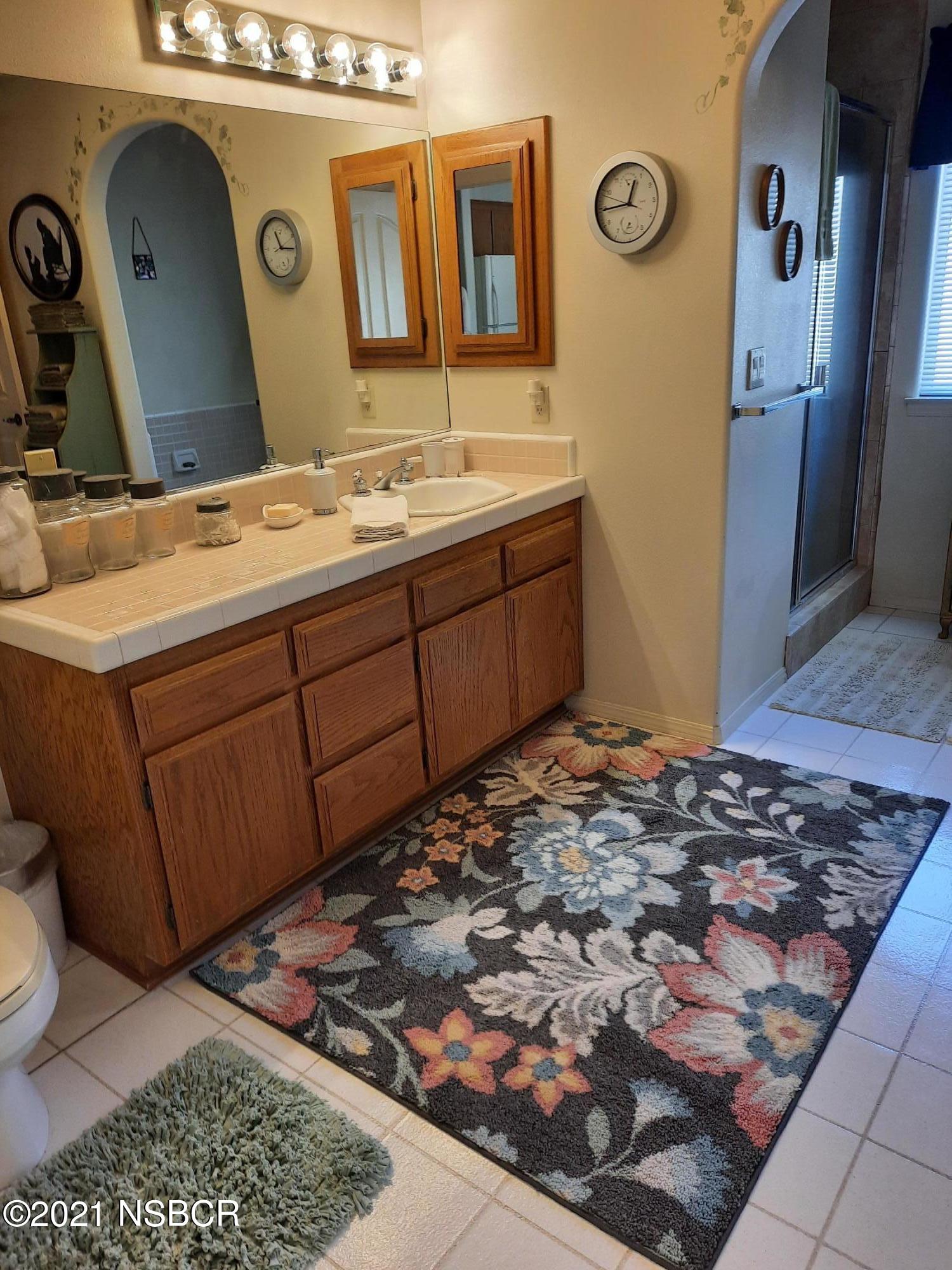 3165 Christopher Drive Lompoc, CA 93436 - Photo 42 of 52 a bathroom with a sink and a mirror