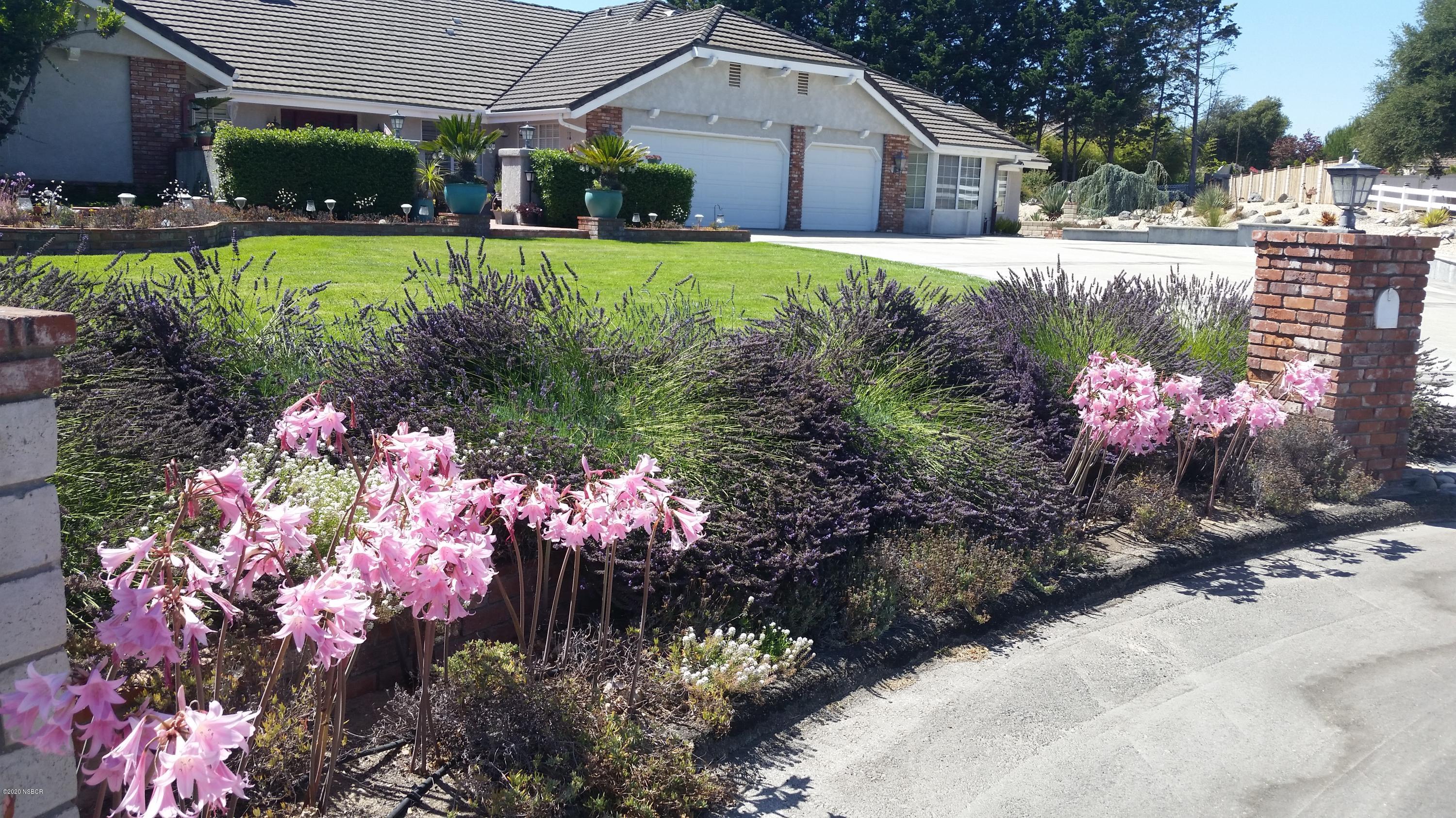 3165 Christopher Drive Lompoc, CA 93436 - Photo 50 of 52 a view of a house with a yard and garden