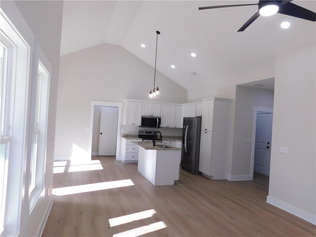 98 Elbert Gaddis Road Dahlonega, GA 30533 - Photo 11 of 38 a kitchen with a refrigerator a sink and a stove