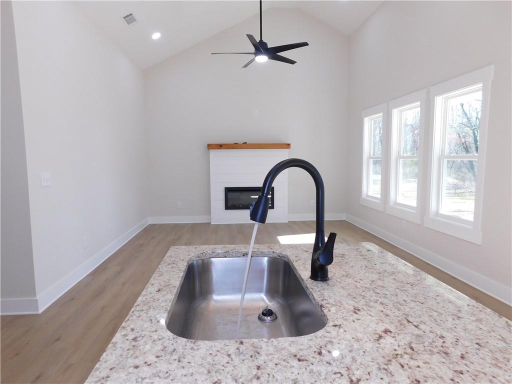 98 Elbert Gaddis Road Dahlonega, GA 30533 - Photo 14 of 38 a kitchen with a sink a counter and a window