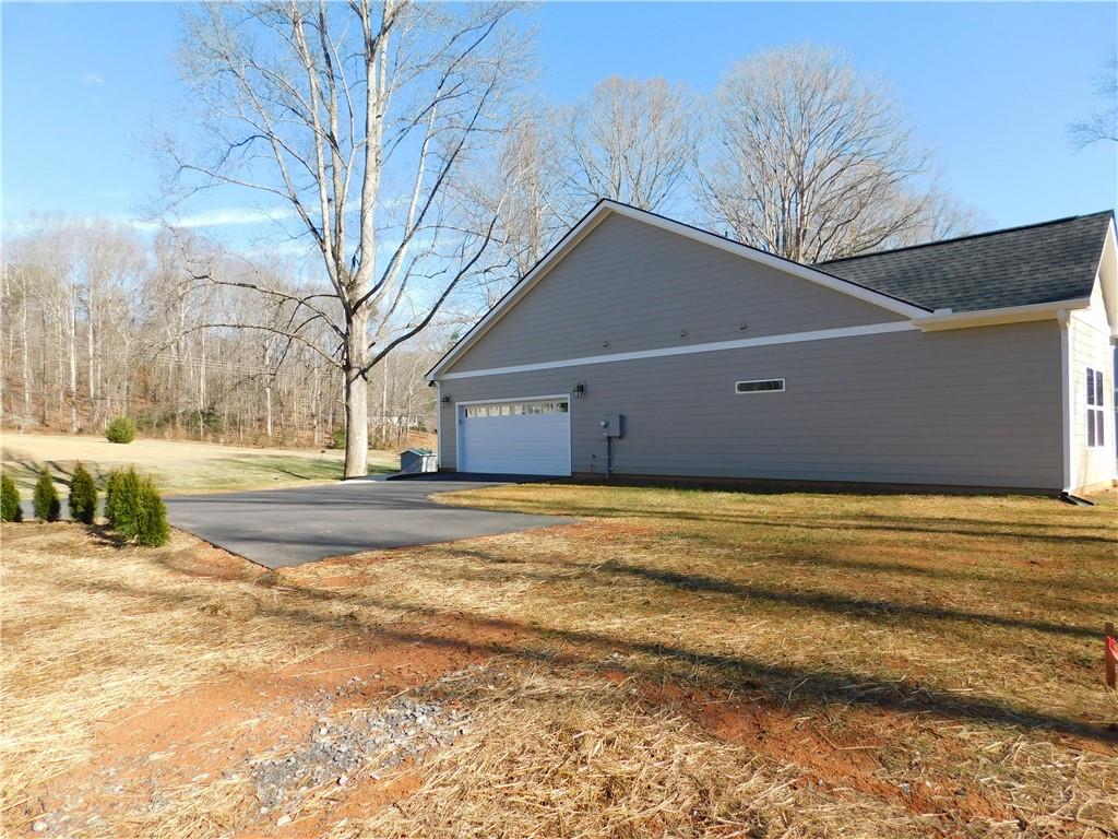 98 Elbert Gaddis Road Dahlonega, GA 30533 - Photo 35 of 38 a view of pool and front of house