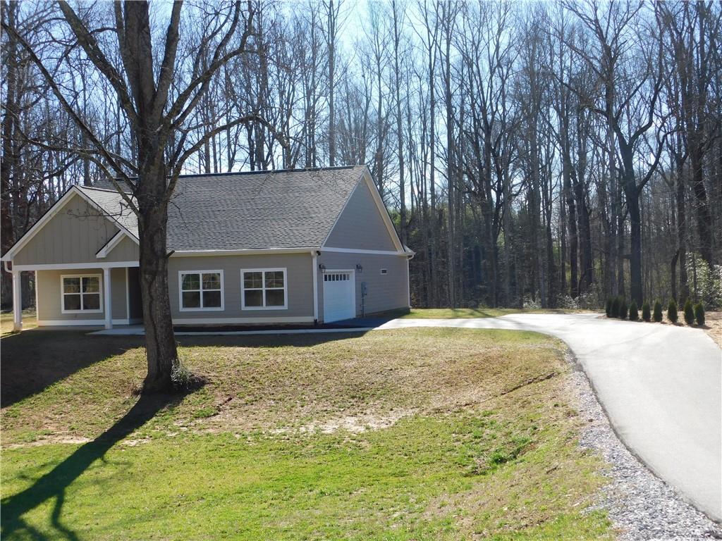 98 Elbert Gaddis Road Dahlonega, GA 30533 - Photo 4 of 38 a front view of a house with a yard and trees