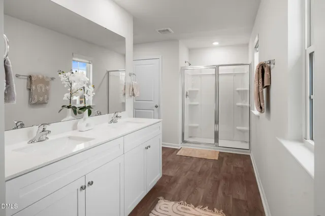 a bedroom with a bed and a chair