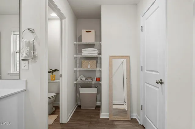 a bedroom with a bed and a television