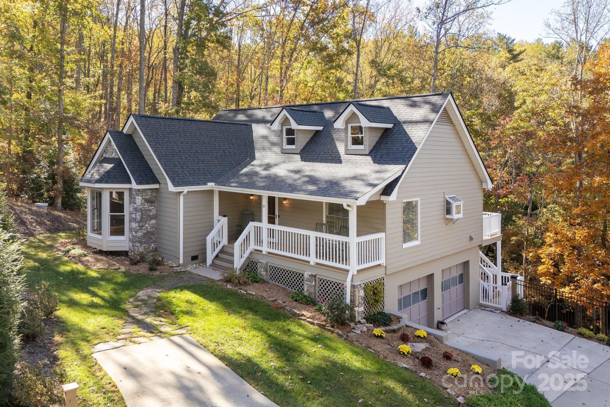 10 Tahchee Trail Fletcher, NC 28732 - Photo 1 of 48 a aerial view of a house with swimming pool and sitting area