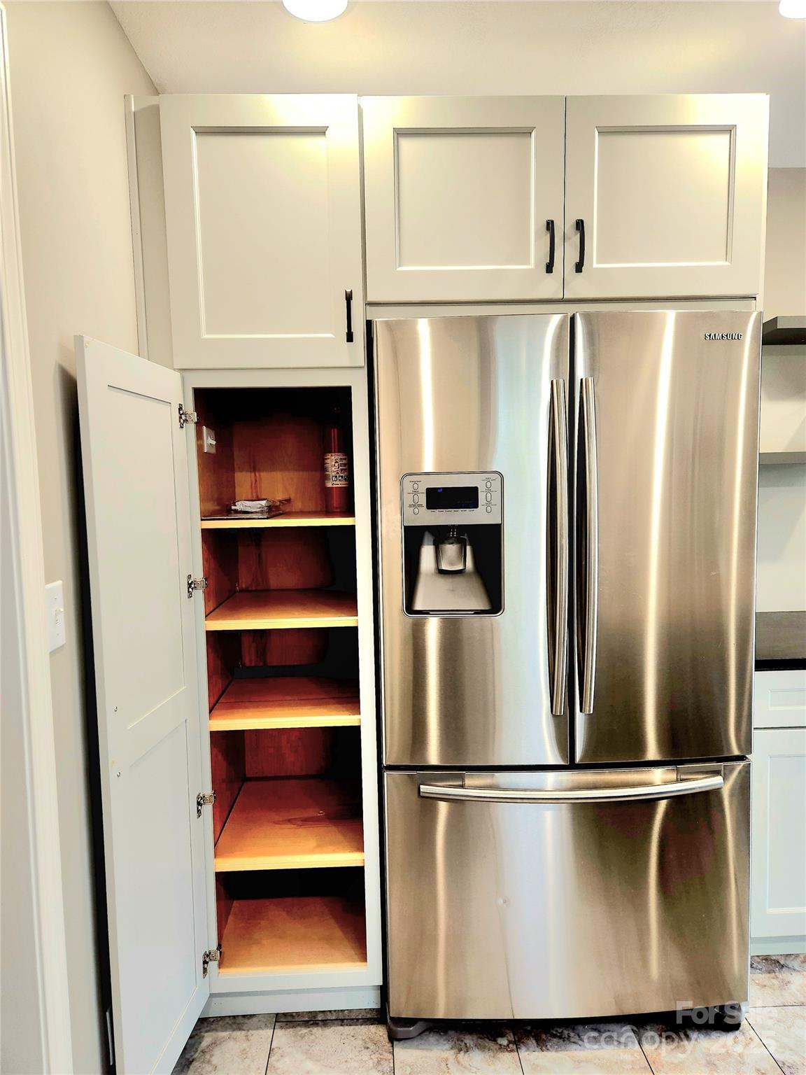 10 Tahchee Trail Fletcher, NC 28732 - Photo 14 of 48 a kitchen with a refrigerator and white walls
