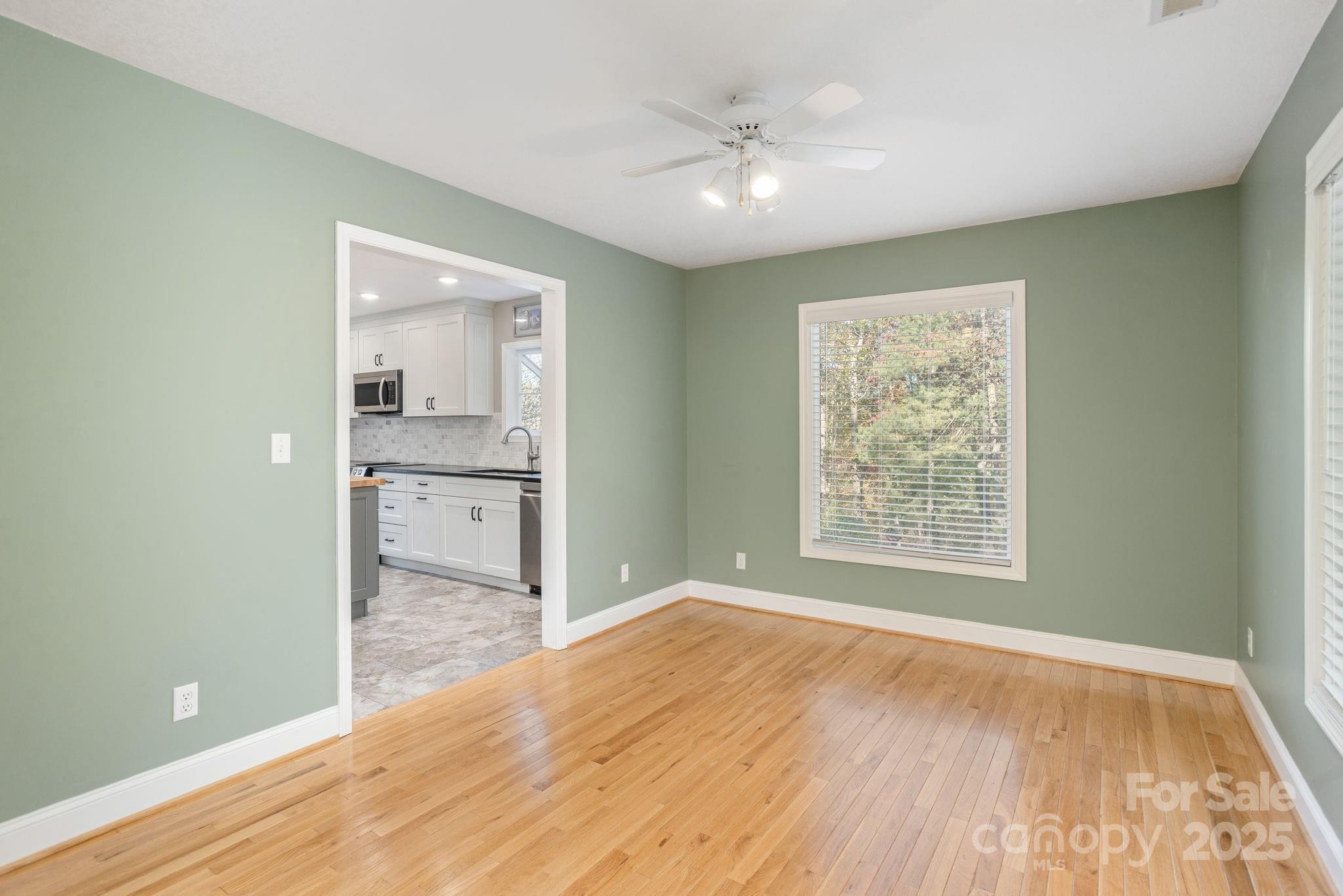 10 Tahchee Trail Fletcher, NC 28732 - Photo 15 of 48 an empty room with wooden floor and a window