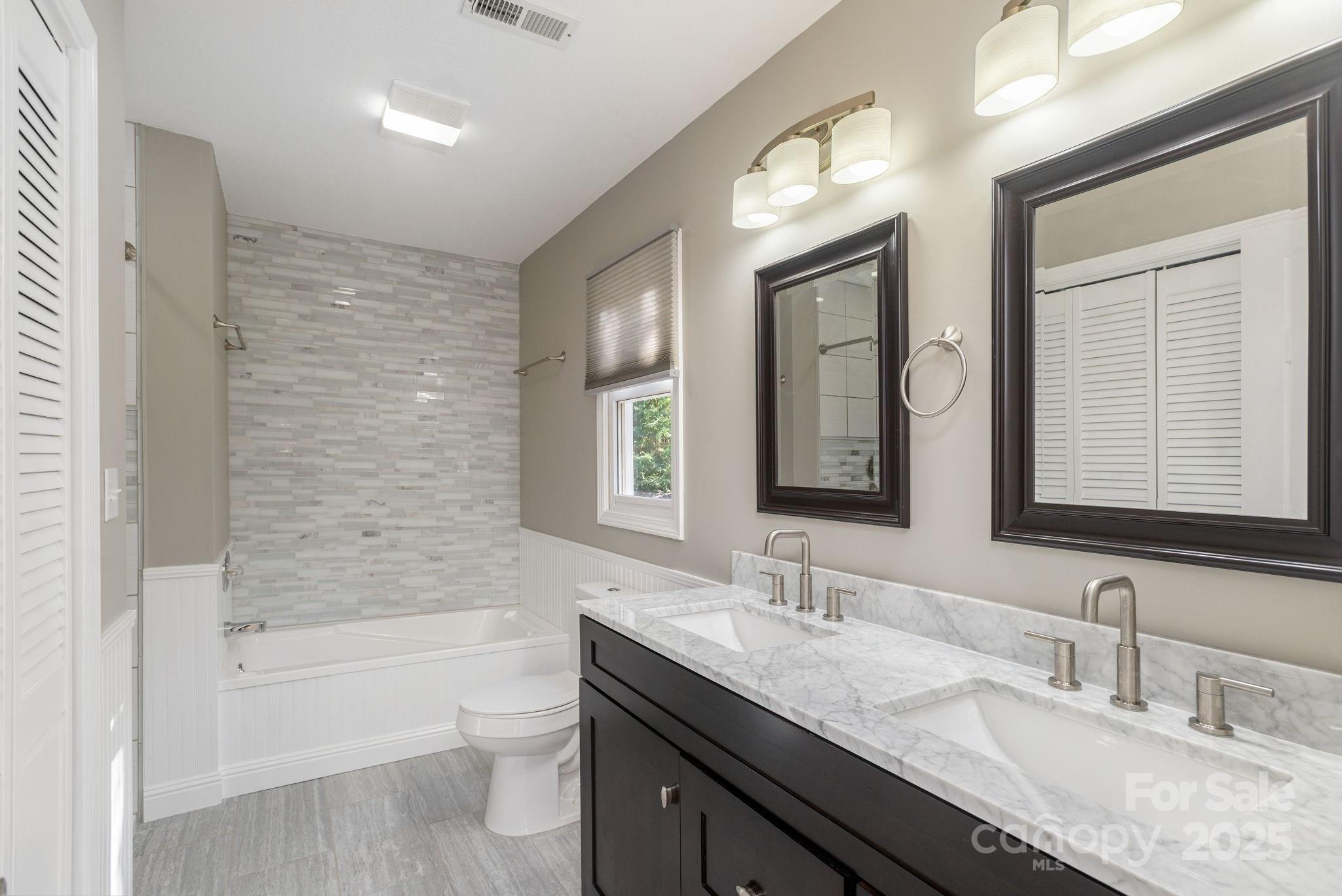 10 Tahchee Trail Fletcher, NC 28732 - Photo 19 of 48 a bathroom with a granite countertop sink toilet and shower