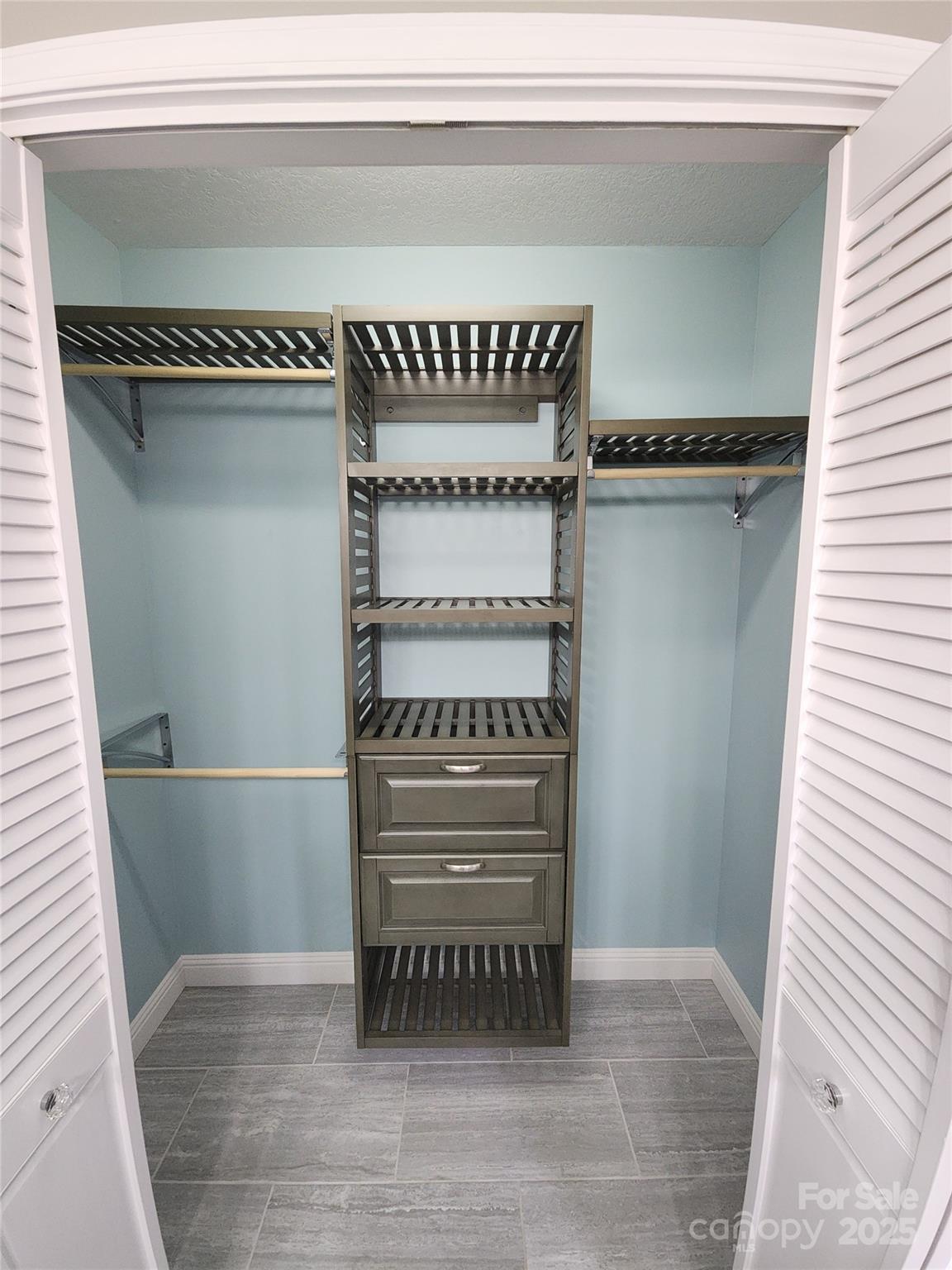 10 Tahchee Trail Fletcher, NC 28732 - Photo 23 of 48 a view of walk in closet with clothes