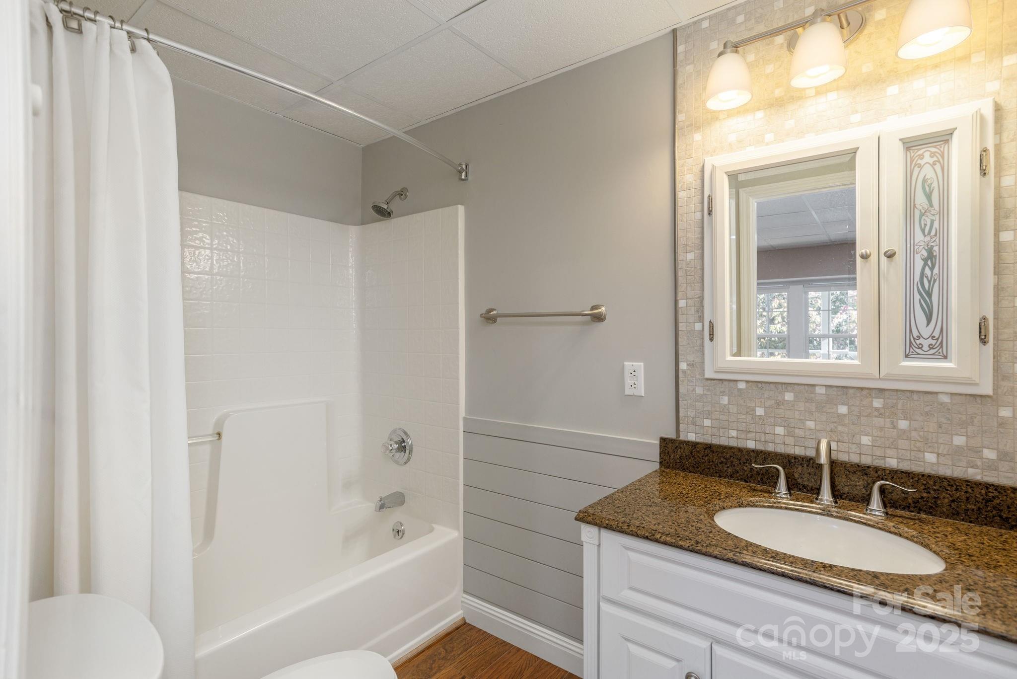 10 Tahchee Trail Fletcher, NC 28732 - Photo 32 of 48 a bathroom with a granite countertop sink and a mirror