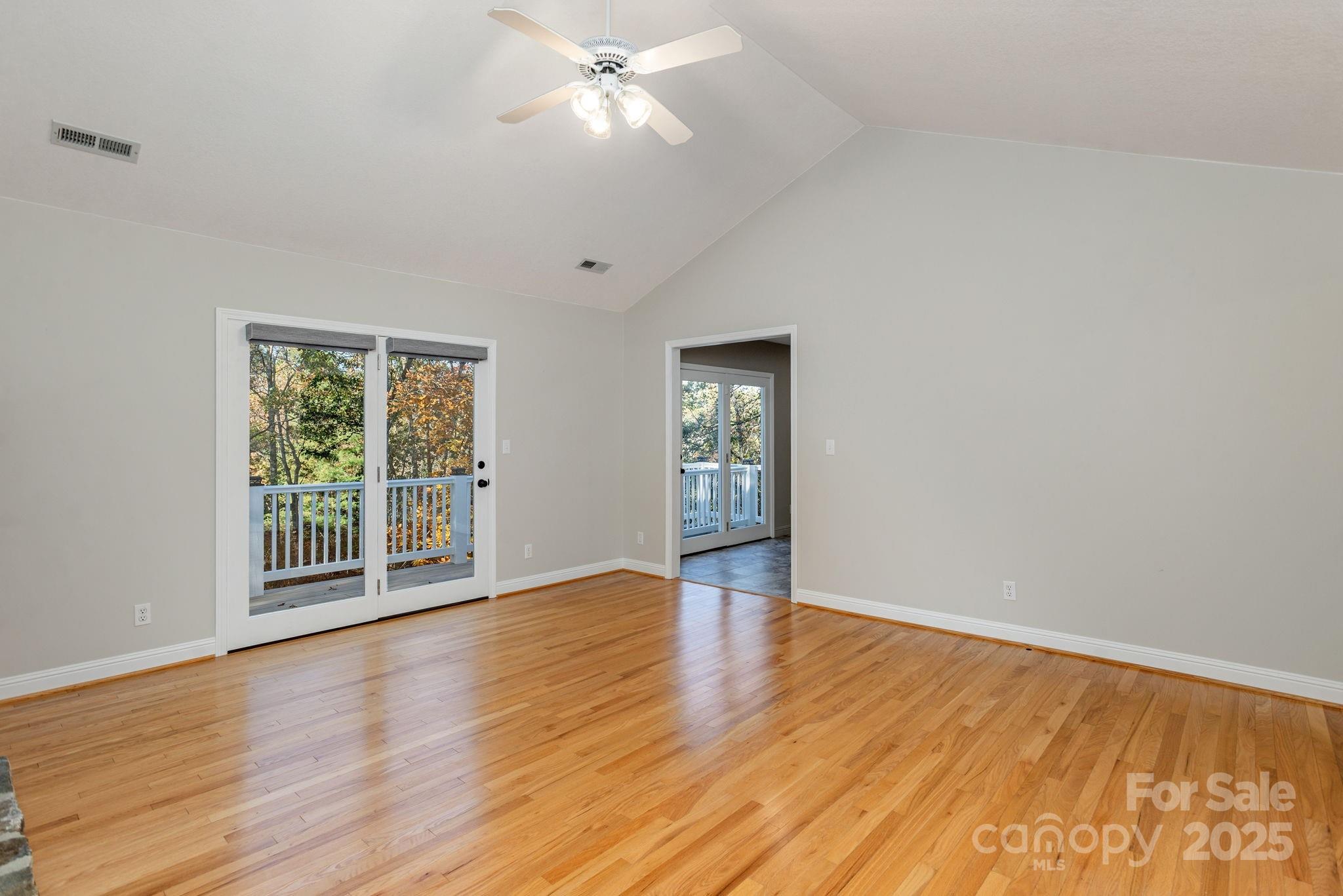 10 Tahchee Trail Fletcher, NC 28732 - Photo 7 of 48 a view of an empty room with wooden floor and a window