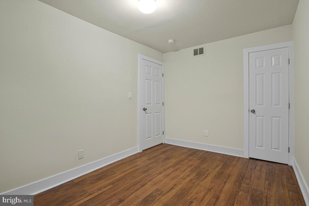 3427 B Street Southeast, Unit 1 Washington, DC 20019 - Photo 15 of 17 a view of an empty room with wooden floor