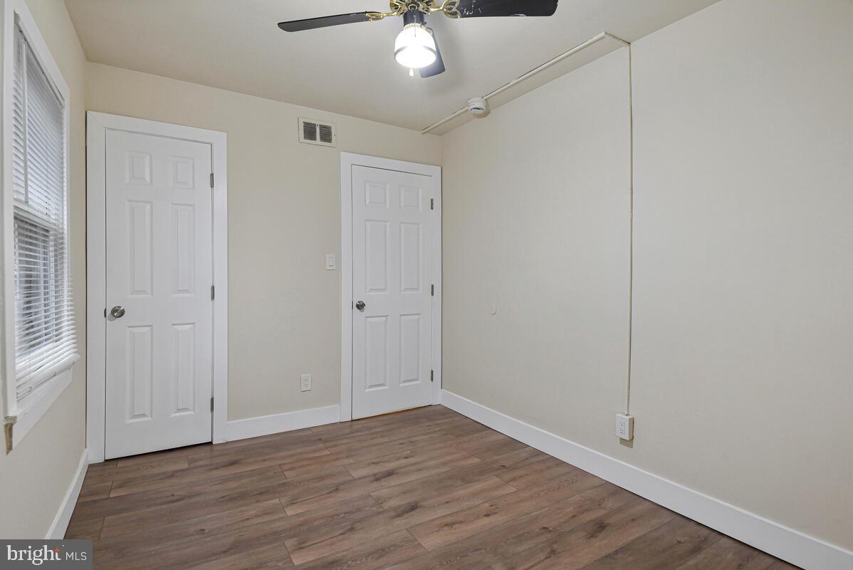 3427 B Street Southeast, Unit 1 Washington, DC 20019 - Photo 17 of 17 a view of an empty room with wooden floor