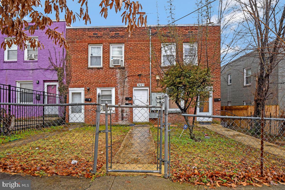 3427 B Street Southeast, Unit 1 Washington, DC 20019 - Photo 2 of 17 front view of a house with a yard
