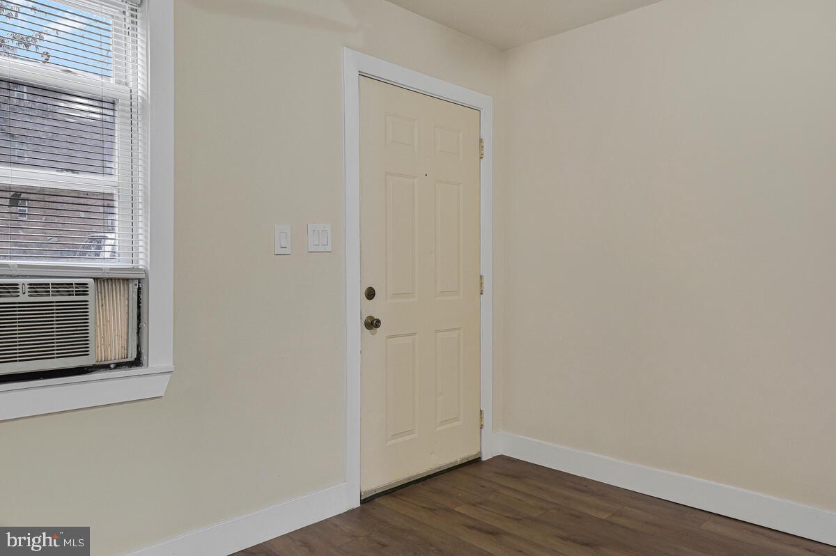 3427 B Street Southeast, Unit 1 Washington, DC 20019 - Photo 5 of 17 a view of empty room with wooden floor and fan