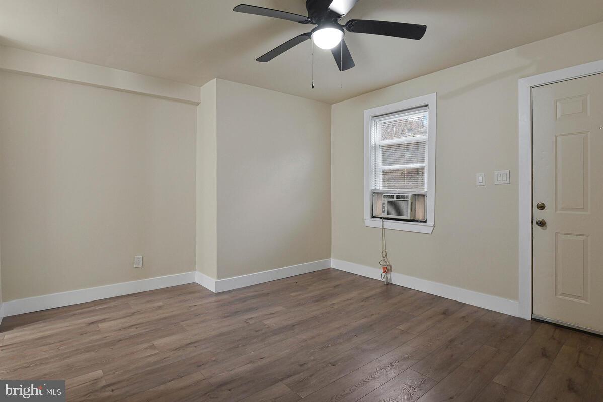 3427 B Street Southeast, Unit 1 Washington, DC 20019 - Photo 7 of 17 a view of empty room with wooden floor and fan