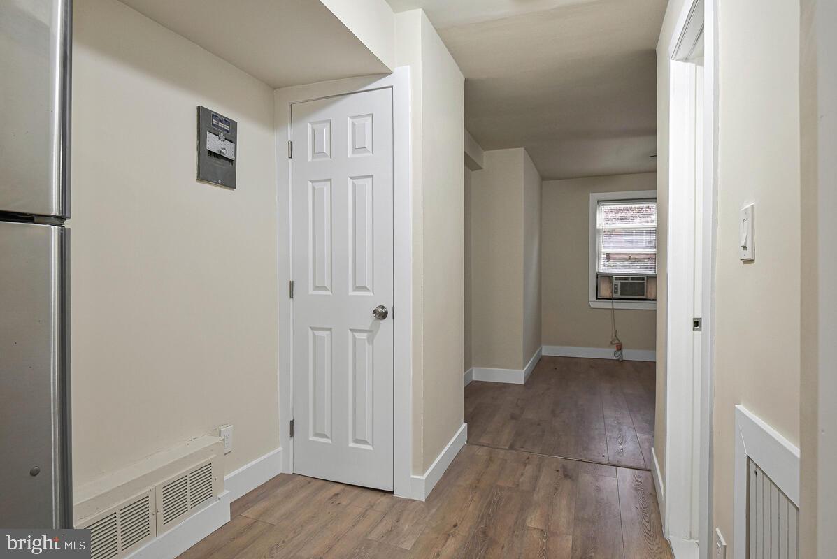 3427 B Street Southeast, Unit 1 Washington, DC 20019 - Photo 8 of 17 a view of a hallway with wooden floor and closet