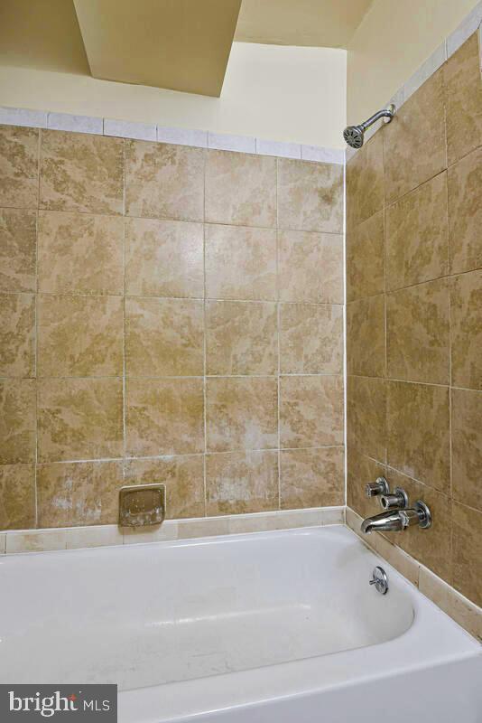 3427 B Street Southeast, Unit 1 Washington, DC 20019 - Photo 10 of 17 a bathroom with a bathtub and a shower