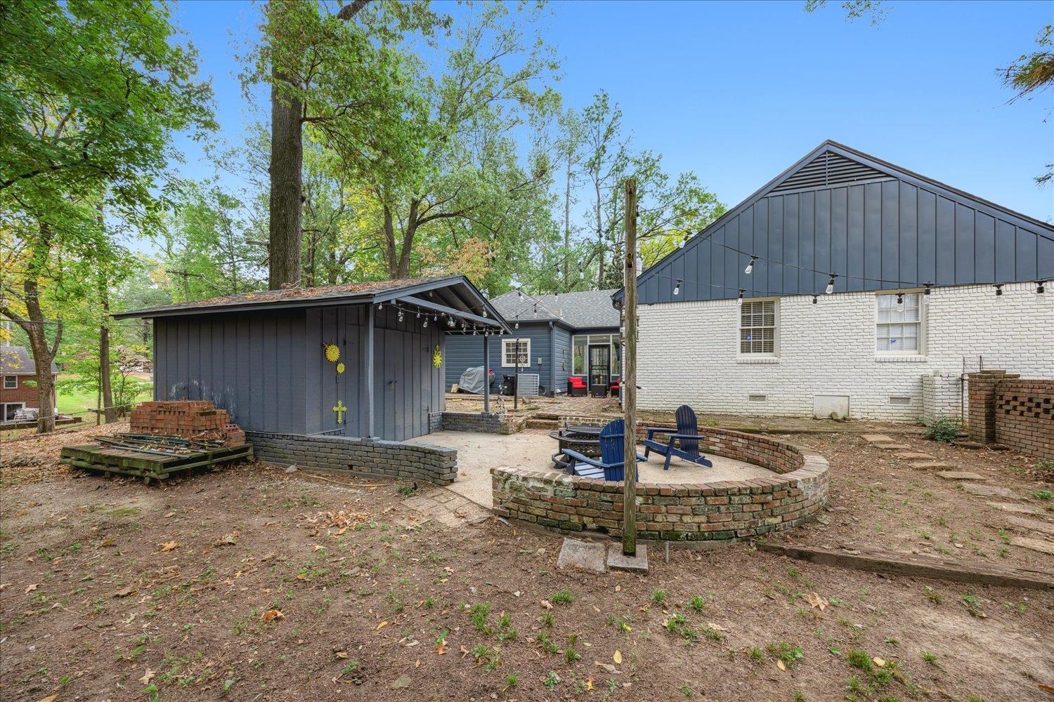 3076 Laurencekirk Road Memphis, TN 38128 - Photo 19 of 23 Rear view of property with a patio area and an outdoor fire pit