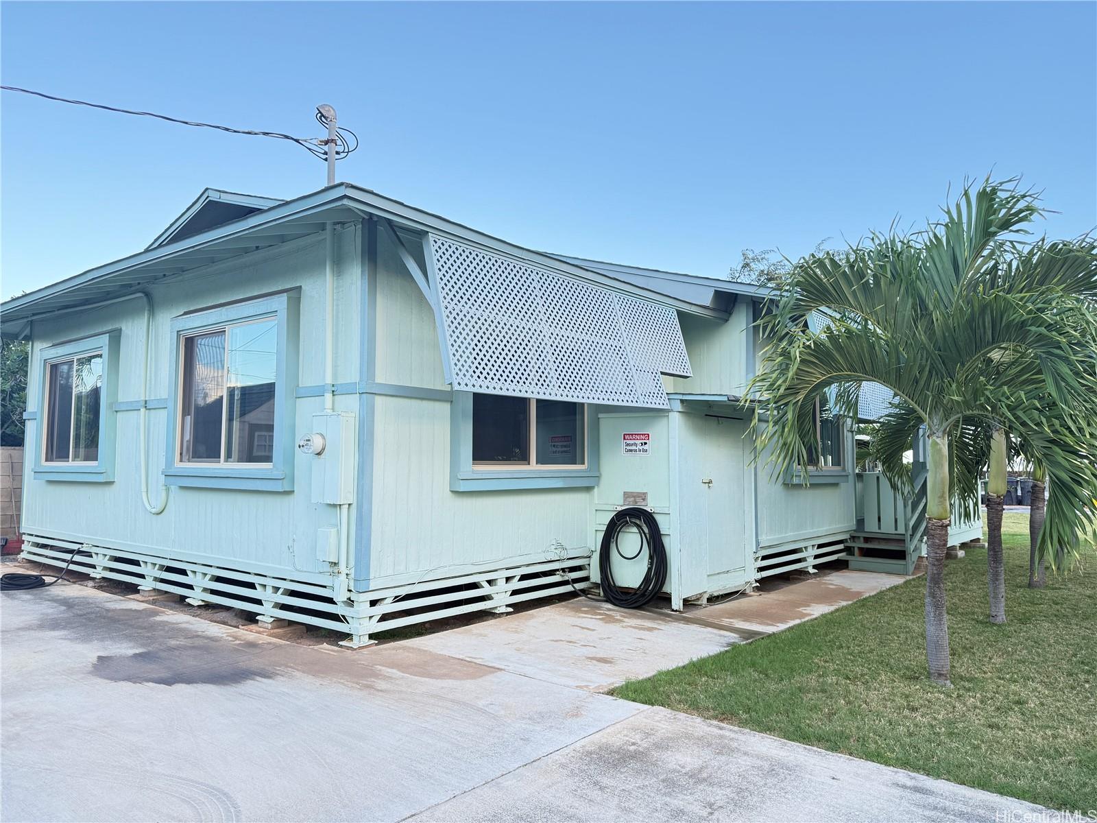91-249 Ewa Beach Road Ewa Beach, HI 96706 - Photo 13 of 25 a front view of a house