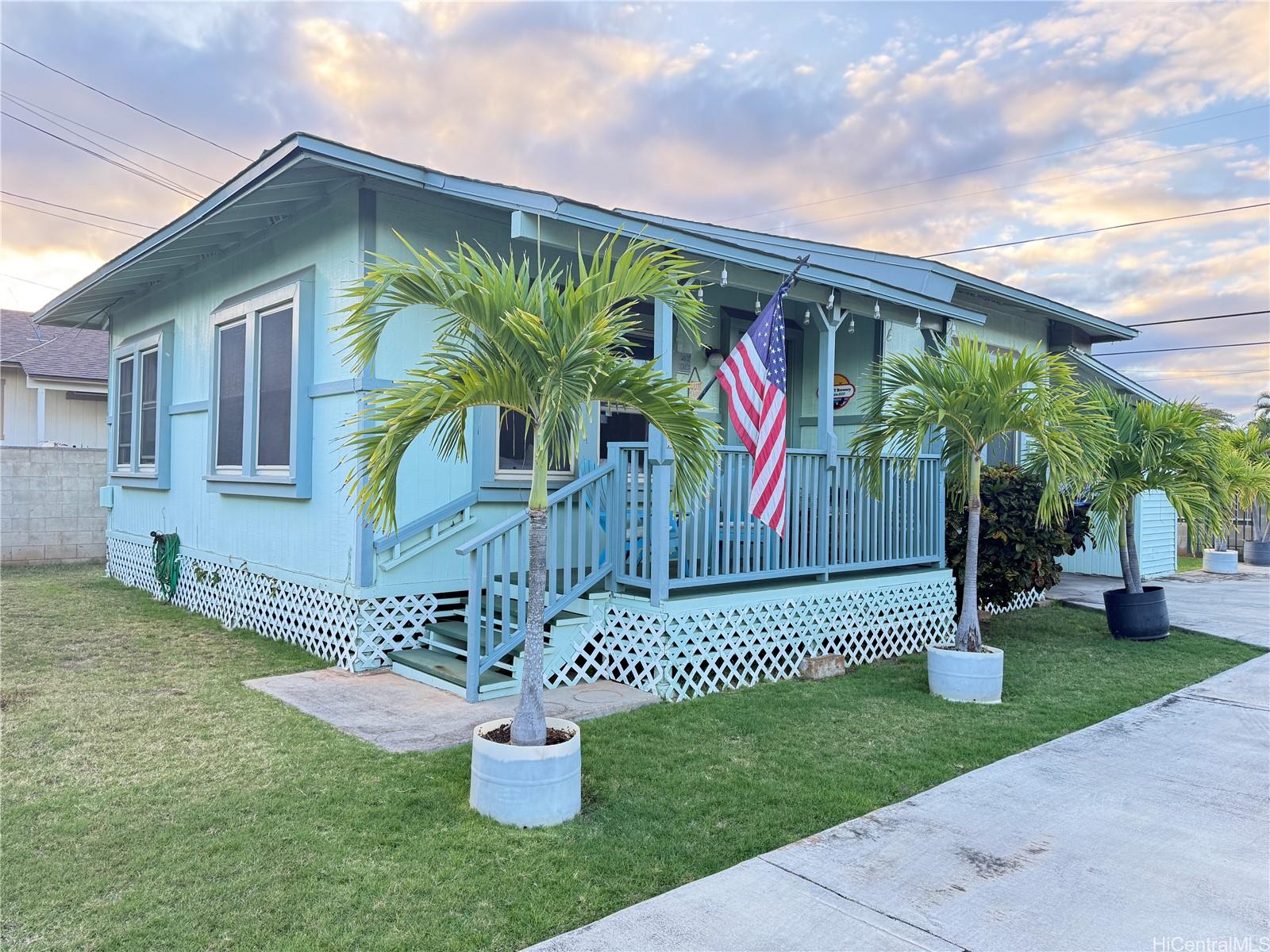 91-249 Ewa Beach Road Ewa Beach, HI 96706 - Photo 4 of 25 a front view of a house with garden