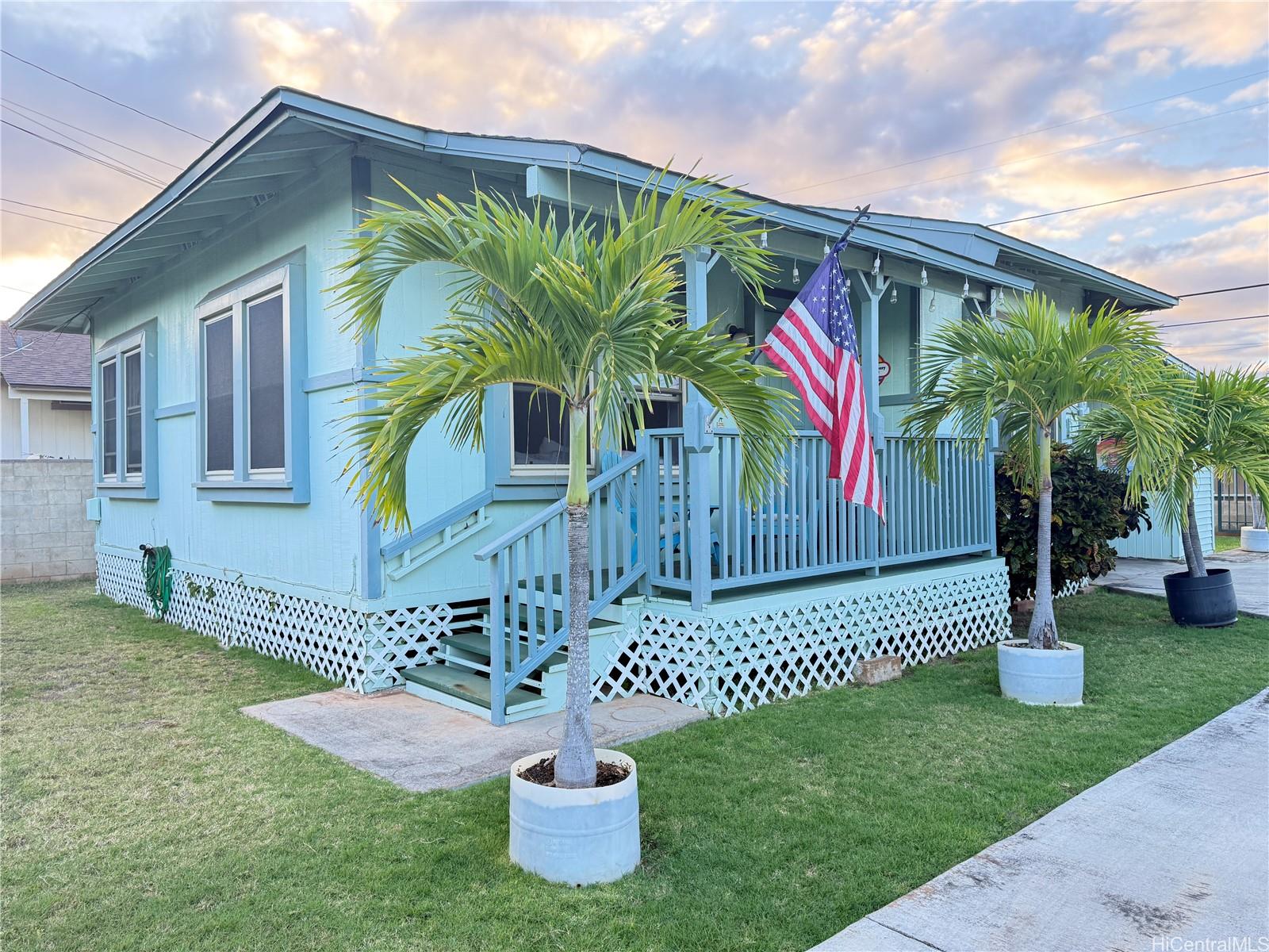 91-249 Ewa Beach Road Ewa Beach, HI 96706 - Photo 8 of 25 a front view of a house with garden