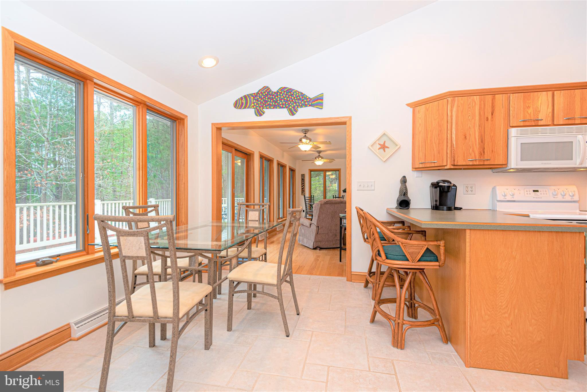 9434 Croppers Island Road Newark, MD 21841 - Photo 15 of 48 a dining room filled with furniture and a potted plant