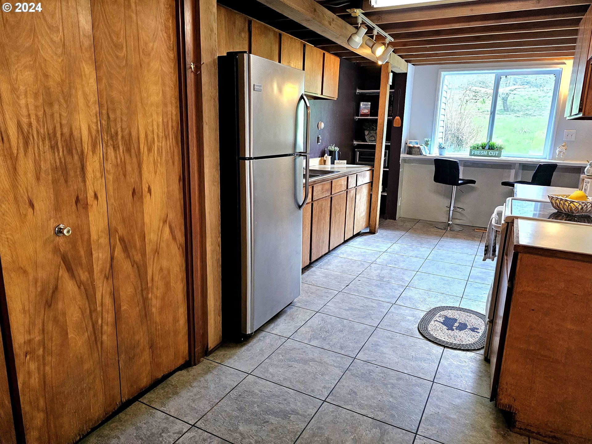 16850 Southeast Walnut Hill Road Amity, OR 97101 - Photo 11 of 47 a kitchen with stainless steel appliances a refrigerator and a stove