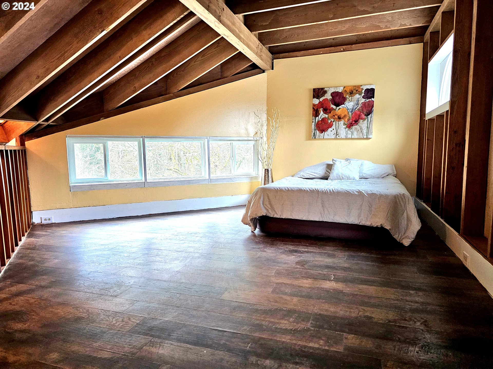 16850 Southeast Walnut Hill Road Amity, OR 97101 - Photo 22 of 47 a spacious bedroom with a bed and a large window