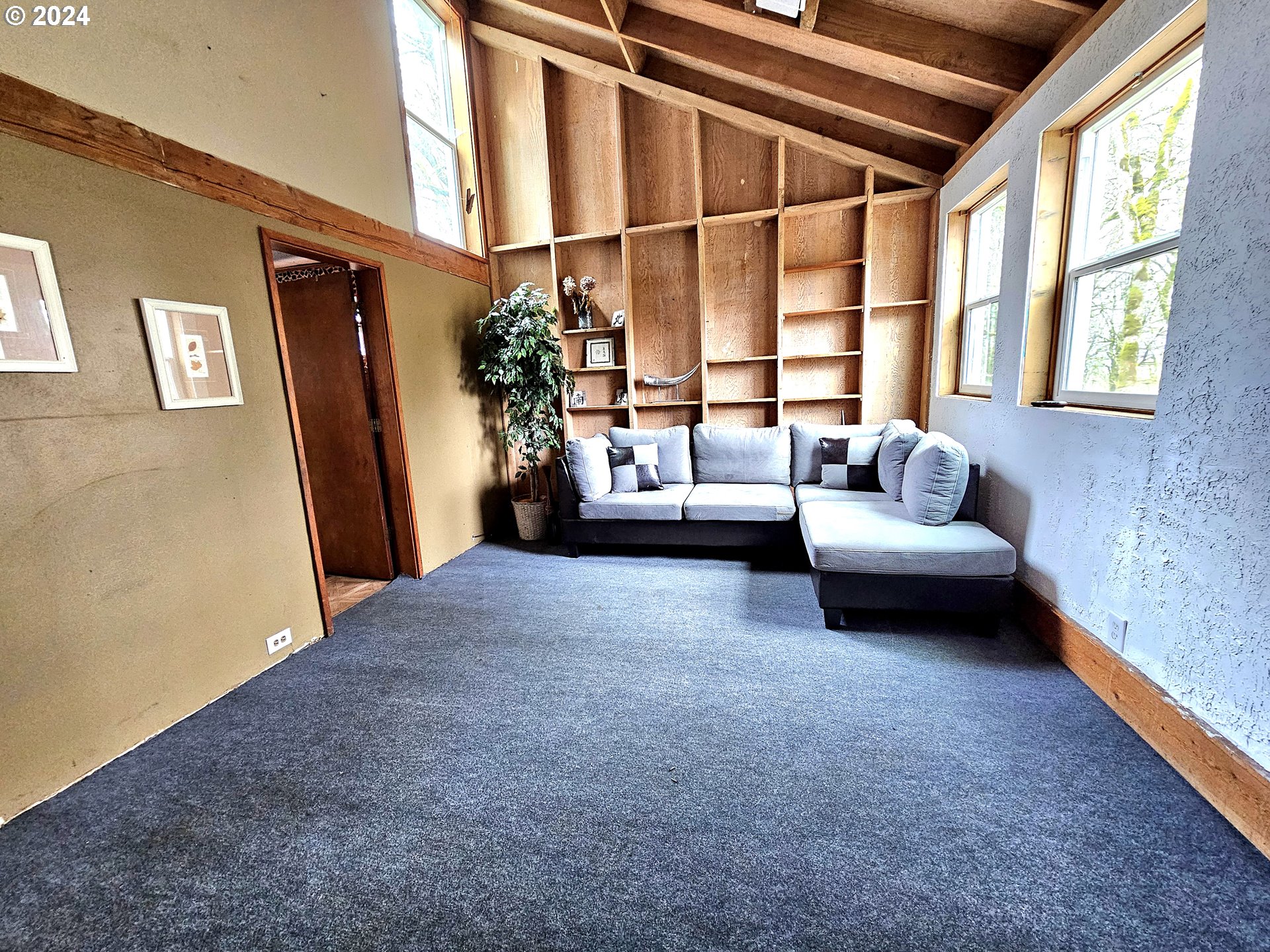 16850 Southeast Walnut Hill Road Amity, OR 97101 - Photo 27 of 47 a living room with furniture and a large window