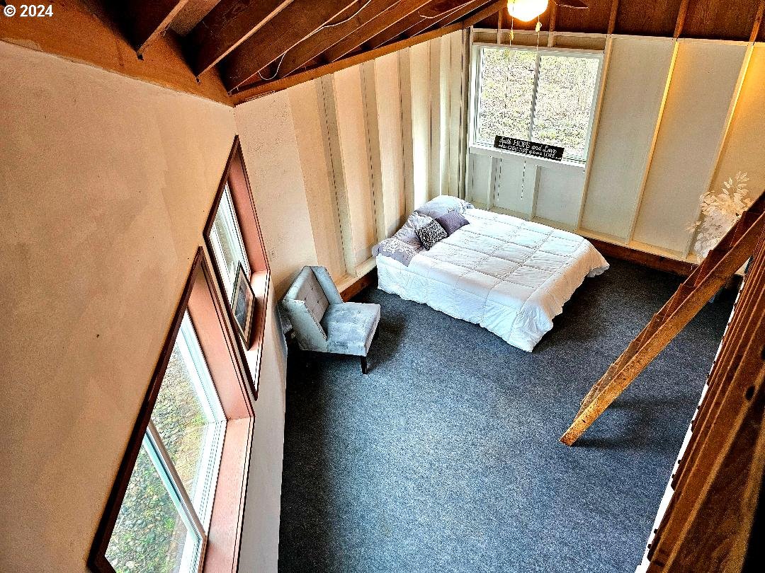 16850 Southeast Walnut Hill Road Amity, OR 97101 - Photo 31 of 47 a bedroom with a bed and a window