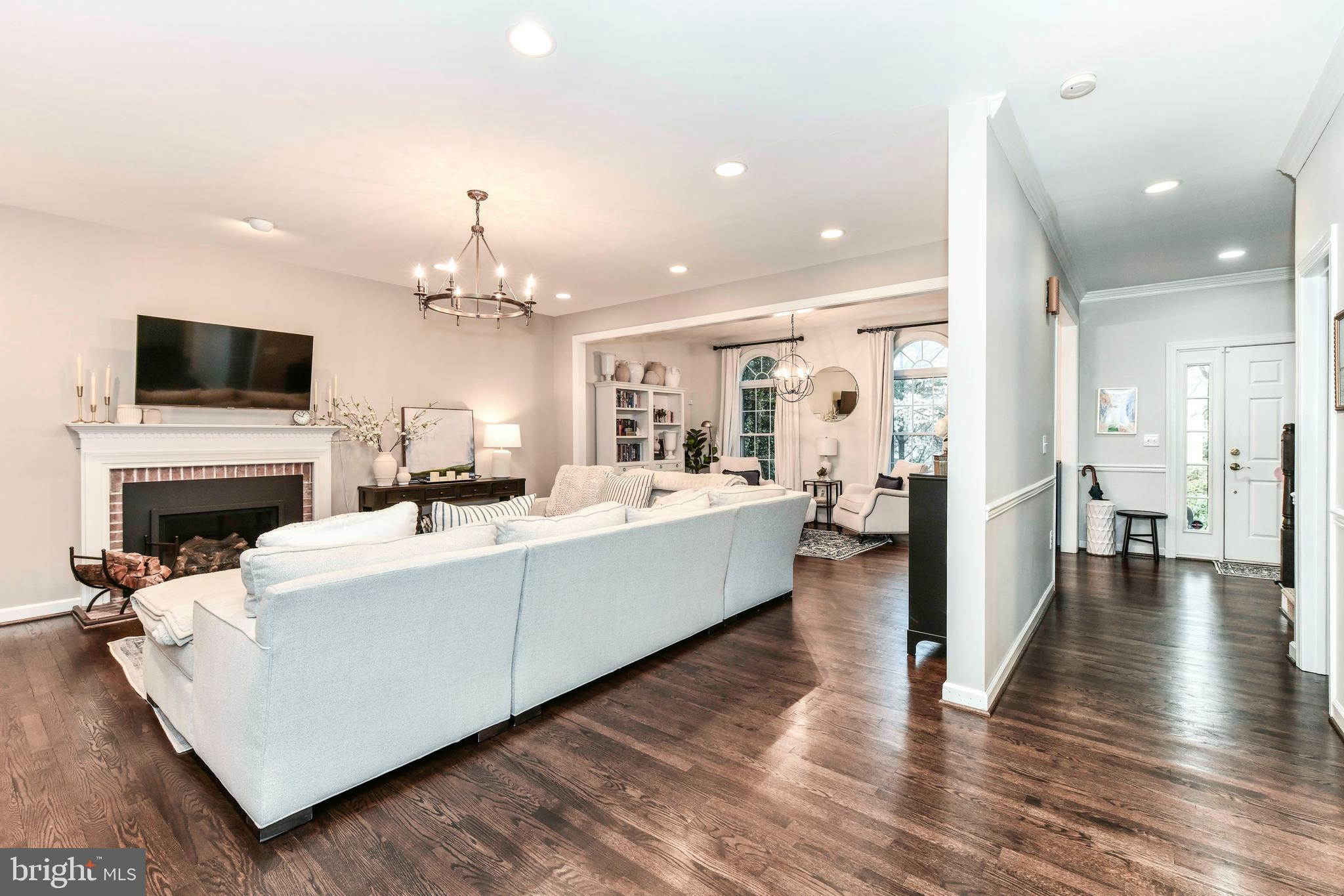 6866 Melrose Drive McLean, VA 22101 - Photo 14 of 42 a living room with fireplace furniture and a flat screen tv