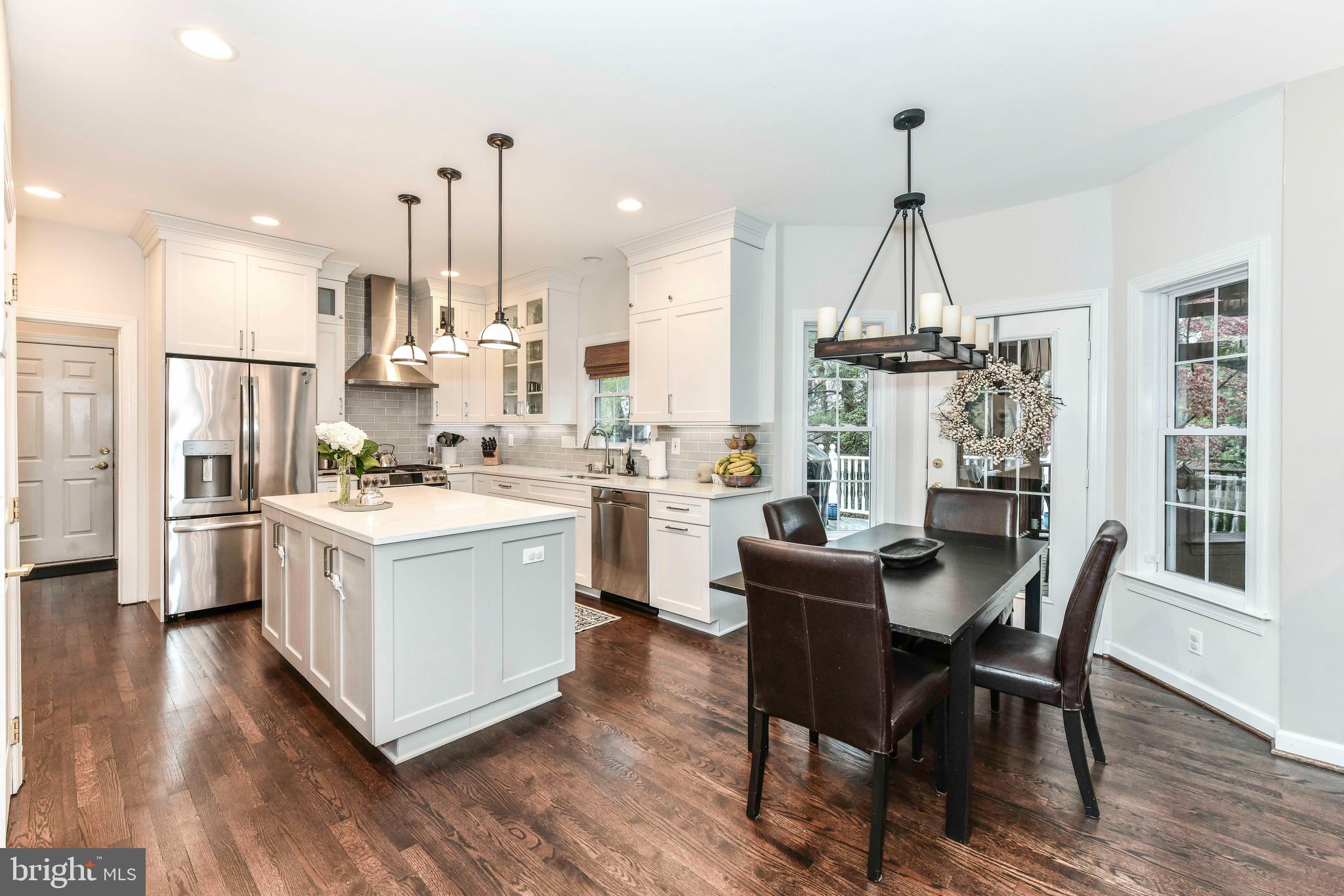 6866 Melrose Drive McLean, VA 22101 - Photo 16 of 42 a kitchen that has a lot of cabinets and stainless steel appliances