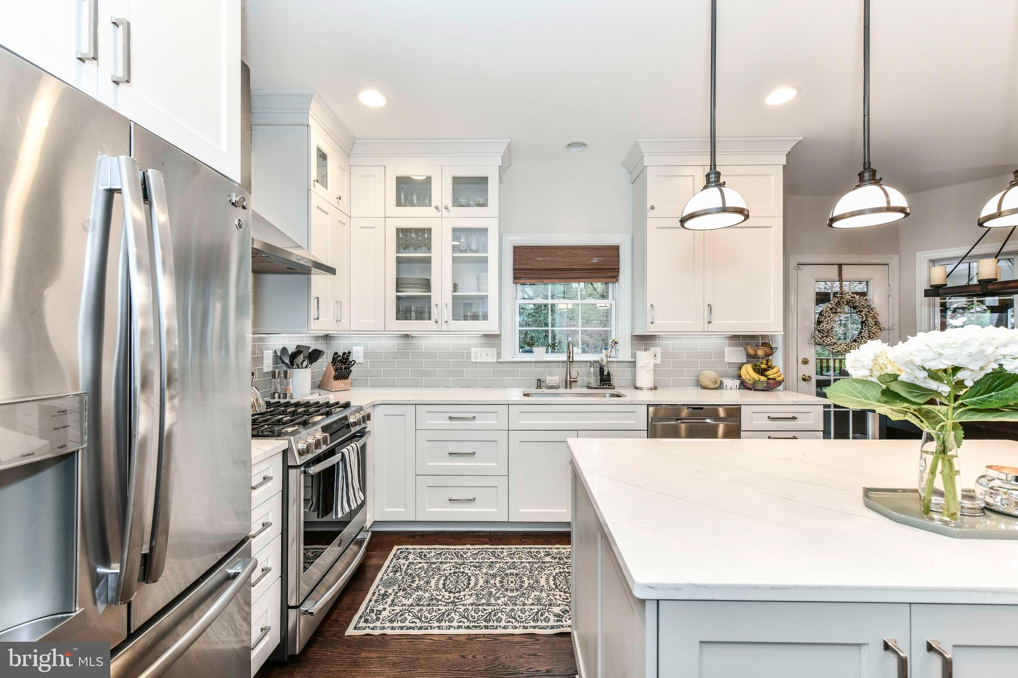 6866 Melrose Drive McLean, VA 22101 - Photo 17 of 42 a kitchen with a sink stainless steel appliances and window