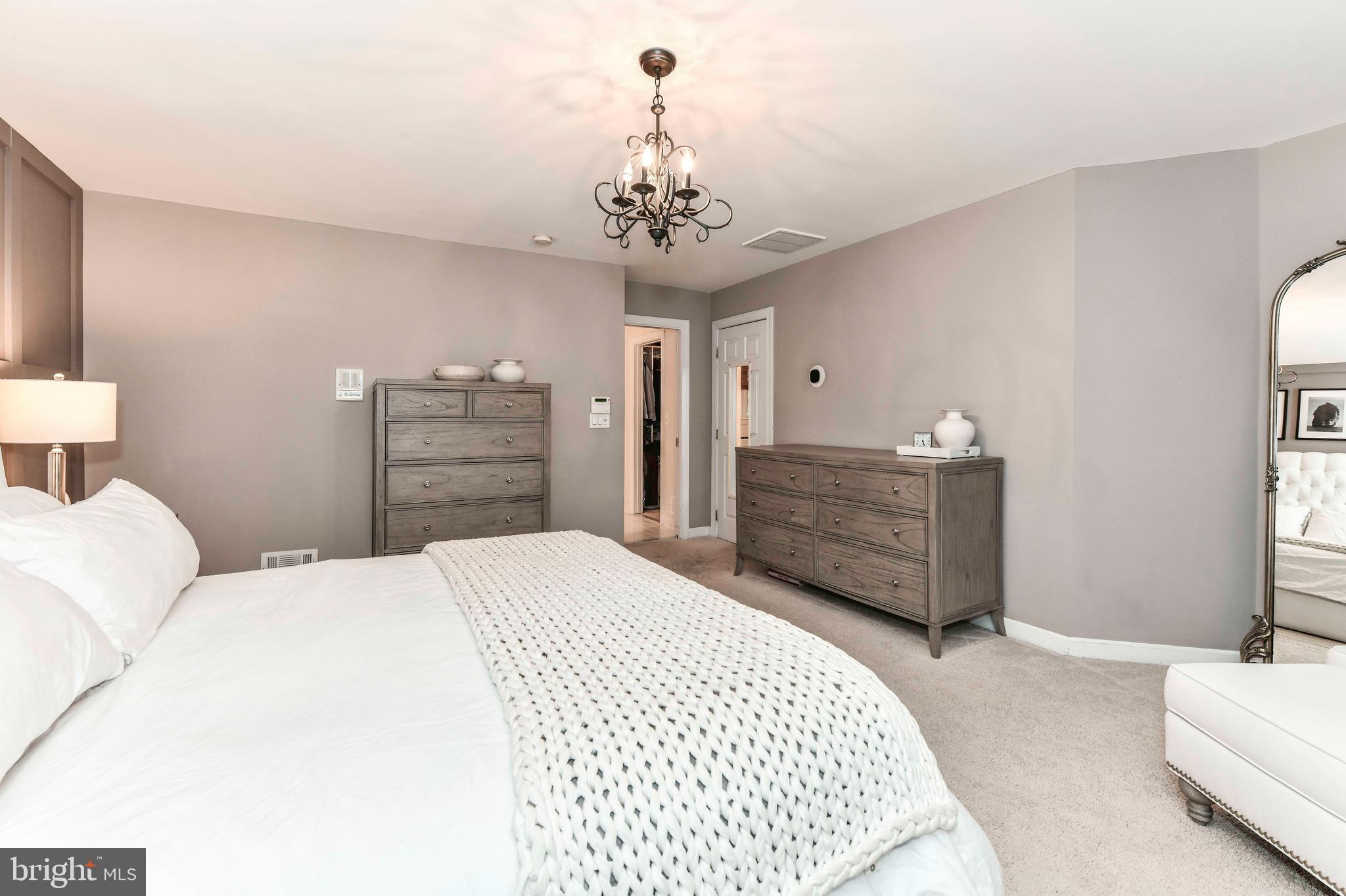 6866 Melrose Drive McLean, VA 22101 - Photo 19 of 42 a bedroom with a bed and a dresser