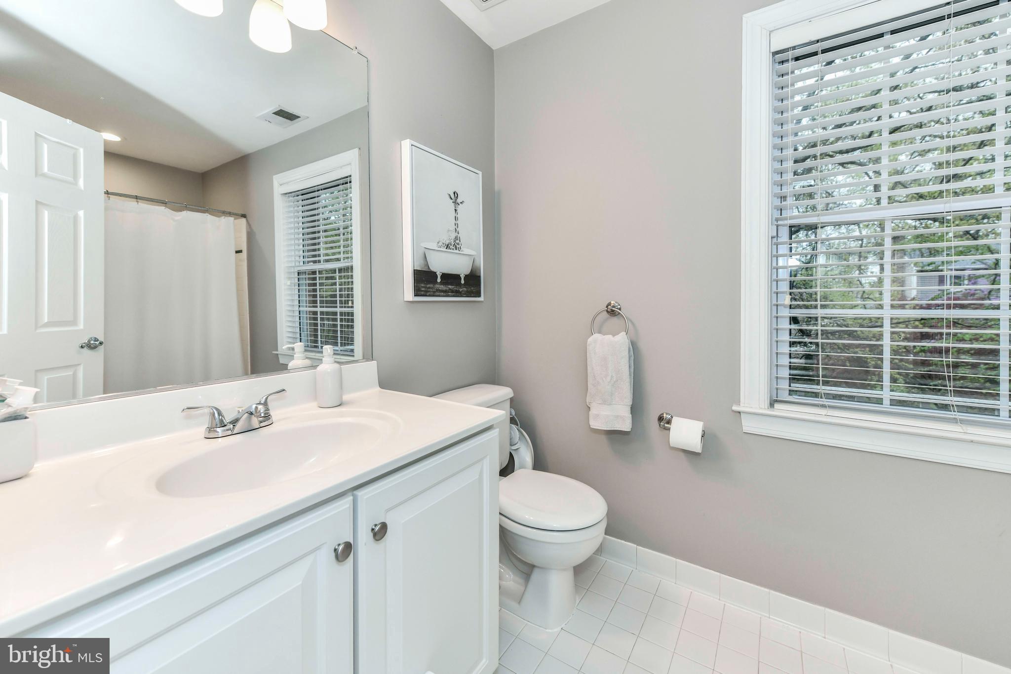 6866 Melrose Drive McLean, VA 22101 - Photo 24 of 42 a bathroom with a sink vanity granite and toilet