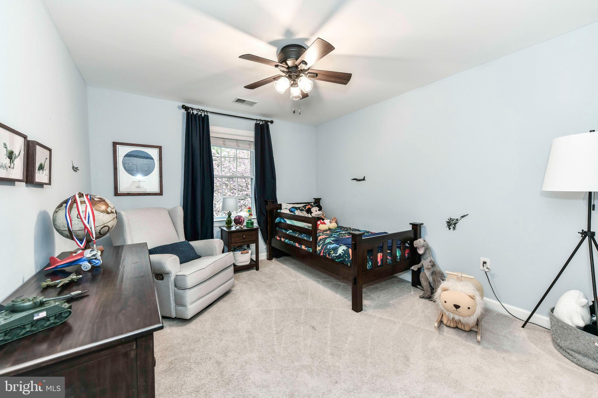 6866 Melrose Drive McLean, VA 22101 - Photo 26 of 42 a living room with furniture and a chandelier